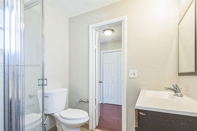 5640 NW 13th Ct, Lauderhill, FL 33313 - bathroom featuring vanity, a stall shower, and wood finished floors
