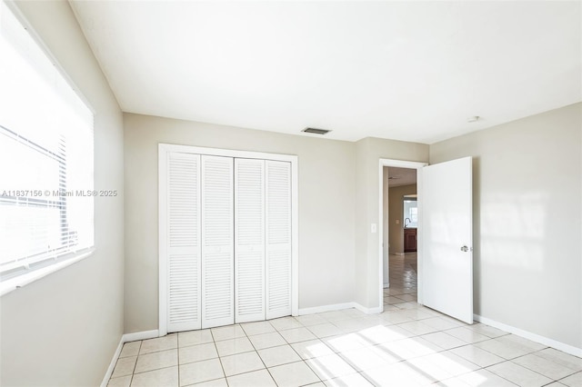 5640 NW 13th Ct, Lauderhill, FL 33313 - unfurnished bedroom with a closet and light tile patterned floors