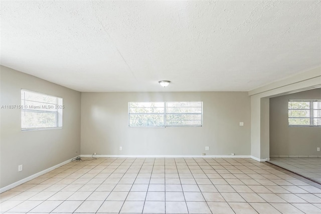 5640 NW 13th Ct, Lauderhill, FL 33313 - spare room with a textured ceiling and light tile patterned flooring