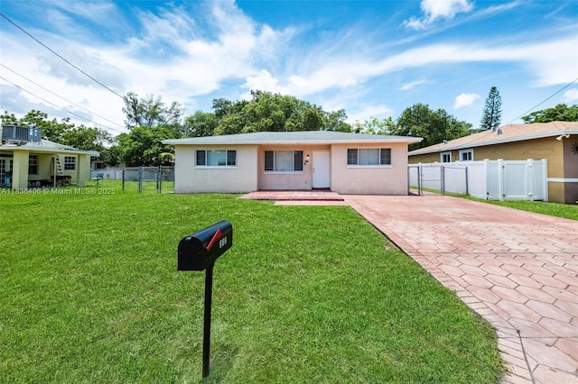 312 SW 2nd Ter, Hallandale Beach, FL 33009 - view of front of home featuring stucco siding and driveway