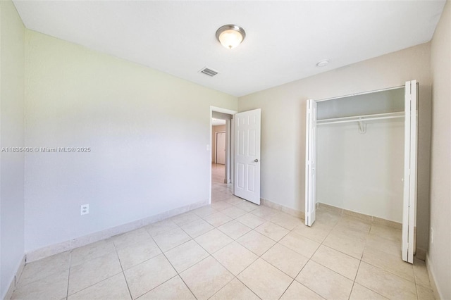 312 SW 2nd Ter, Hallandale Beach, FL 33009 - unfurnished bedroom with light tile patterned floors and a closet