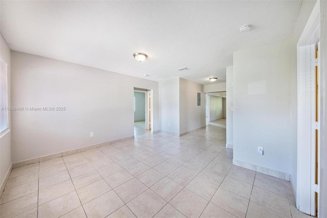 312 SW 2nd Ter, Hallandale Beach, FL 33009 - spare room with light tile patterned flooring and a smoke detector