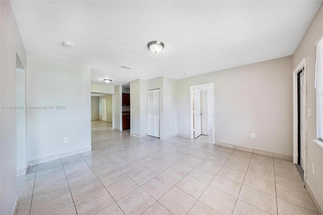 312 SW 2nd Ter, Hallandale Beach, FL 33009 - spare room with light tile patterned floors and baseboards