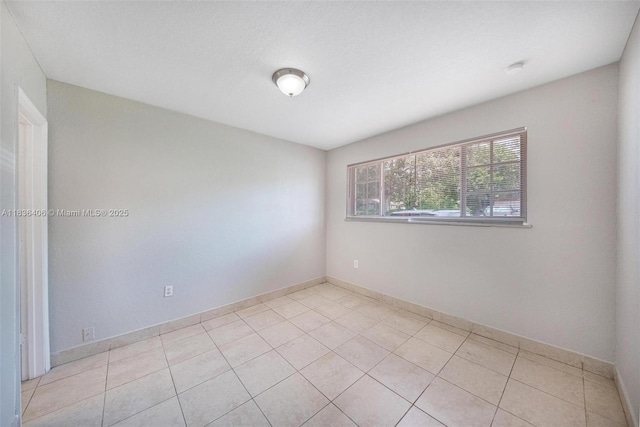 312 SW 2nd Ter, Hallandale Beach, FL 33009 - empty room featuring light tile patterned floors