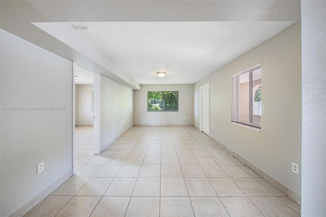 312 SW 2nd Ter, Hallandale Beach, FL 33009 - unfurnished room with light tile patterned floors and baseboards