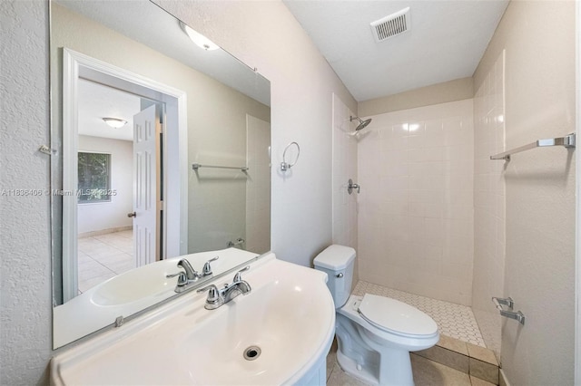 312 SW 2nd Ter, Hallandale Beach, FL 33009 - full bath with a tile shower, vanity, and tile patterned flooring
