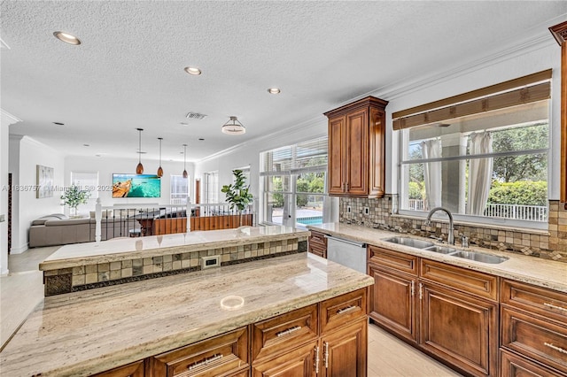 19480 SW 39th Ct, Miramar, FL 33029 - kitchen with backsplash, crown molding, light stone counters, stainless steel dishwasher, and open floor plan