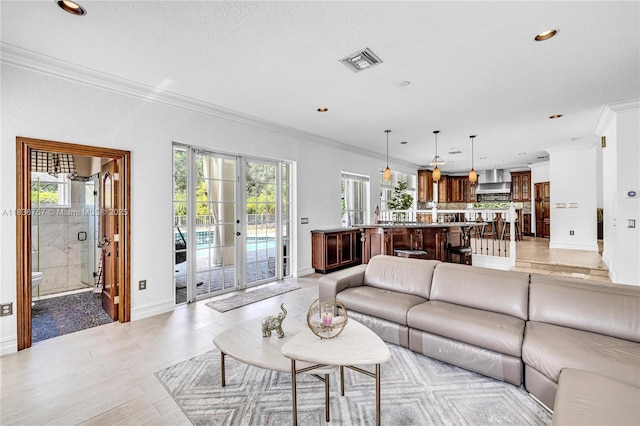 19480 SW 39th Ct, Miramar, FL 33029 - living area featuring ornamental molding, healthy amount of natural light, light wood finished floors, and recessed lighting