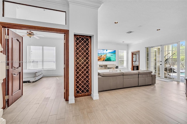 19480 SW 39th Ct, Miramar, FL 33029 - living room featuring crown molding, light wood finished floors, plenty of natural light, and ceiling fan