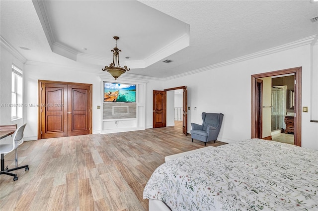 19480 SW 39th Ct, Miramar, FL 33029 - bedroom featuring light wood finished floors, a tray ceiling, crown molding, and ensuite bath