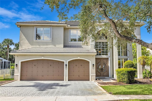 19480 SW 39th Ct, Miramar, FL 33029 - view of front of home featuring a garage, a tiled roof, and stucco siding