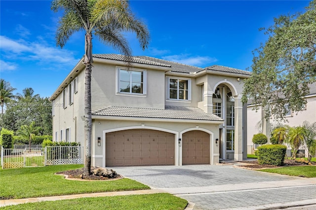 19480 SW 39th Ct, Miramar, FL 33029 - mediterranean / spanish home featuring a garage, a tiled roof, stucco siding, and driveway