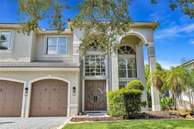 19480 SW 39th Ct, Miramar, FL 33029 - view of front of home featuring stucco siding, a garage, driveway, and a tiled roof