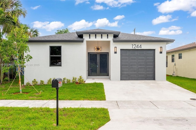 1244 NW 30th Ave, Fort Lauderdale, FL 33311 - prairie-style home featuring an attached garage, concrete driveway, a front yard, and stucco siding