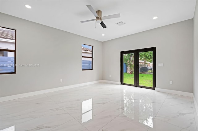 1244 NW 30th Ave, Fort Lauderdale, FL 33311 - spare room featuring light marble finish floors, french doors, ceiling fan, and recessed lighting