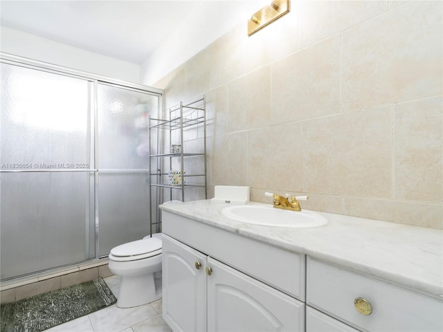 6530 Tyler St, Hollywood, FL 33024 - bathroom featuring tile walls, vanity, a stall shower, tile patterned floors, and decorative backsplash