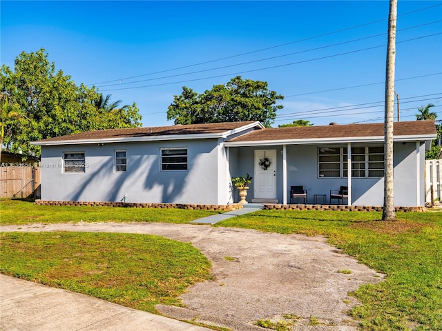 6530 Tyler St, Hollywood, FL 33024 - ranch-style house featuring stucco siding and covered porch