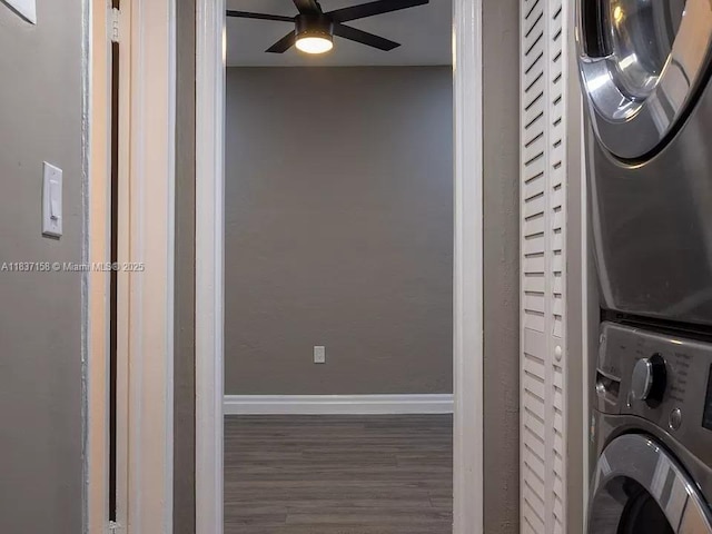 1611 Euclid Ave Unit 5, Miami Beach, FL 33139 - washroom with stacked washer / dryer, wood finished floors, and a ceiling fan