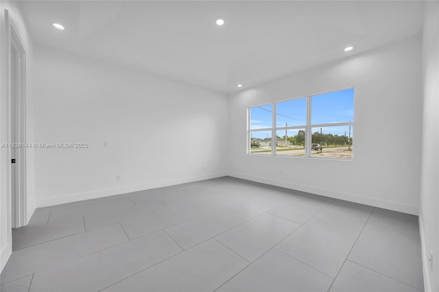 121 SW Sea Lion Rd, Port St Lucie, FL 34953 - spare room featuring recessed lighting and tile patterned floors