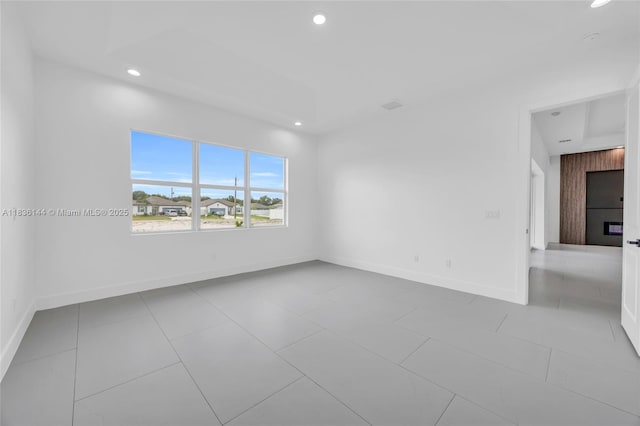 121 SW Sea Lion Rd, Port St Lucie, FL 34953 - spare room with recessed lighting and tile patterned floors