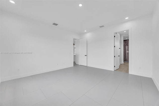 121 SW Sea Lion Rd, Port St Lucie, FL 34953 - spare room featuring recessed lighting and tile patterned floors