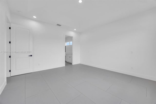 121 SW Sea Lion Rd, Port St Lucie, FL 34953 - tiled empty room featuring recessed lighting and baseboards