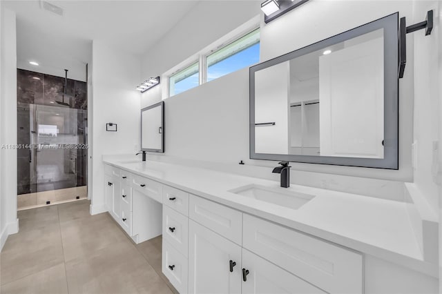 121 SW Sea Lion Rd, Port St Lucie, FL 34953 - bathroom featuring double vanity, a shower stall, tile patterned flooring, and recessed lighting