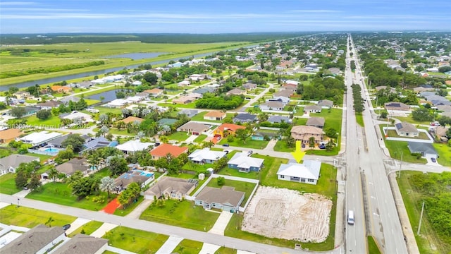 121 SW Sea Lion Rd, Port St Lucie, FL 34953 - aerial perspective of suburban area featuring a nearby body of water