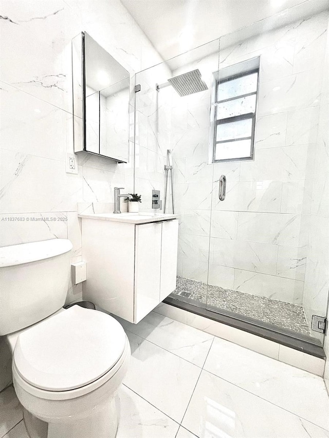 936 Pennsylvania Ave Unit 101, Miami Beach, FL 33139 - full bath featuring marble look tiles, vanity, a stall shower, and tile walls