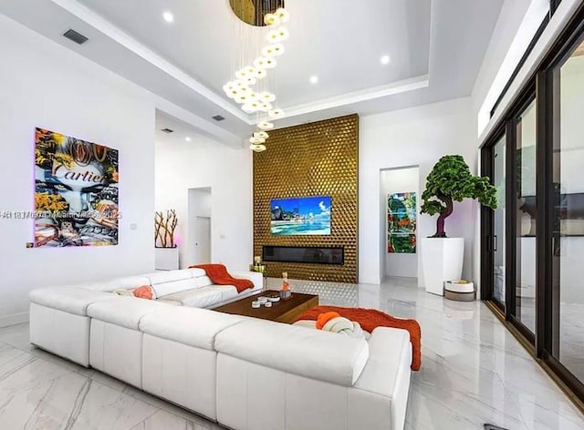 2225 NE 19th St, Fort Lauderdale, FL 33305 - living area featuring light marble finish flooring, a towering ceiling, a chandelier, a tray ceiling, and recessed lighting