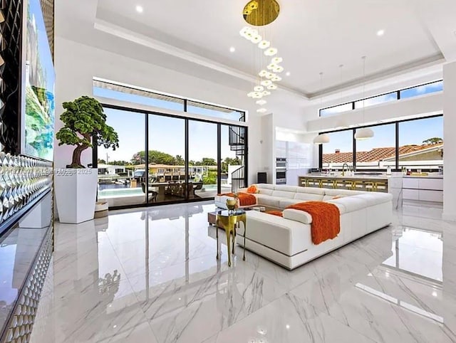 2225 NE 19th St, Fort Lauderdale, FL 33305 - living area with a tray ceiling, plenty of natural light, marble tiled flooring, recessed lighting, and a high ceiling