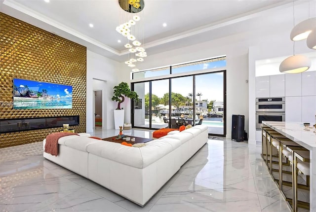 2225 NE 19th St, Fort Lauderdale, FL 33305 - living room with light marble finish floors, a towering ceiling, recessed lighting, ornamental molding, and a raised ceiling