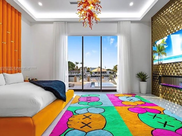 2225 NE 19th St, Fort Lauderdale, FL 33305 - bedroom featuring access to exterior, a tiled fireplace, recessed lighting, and a raised ceiling