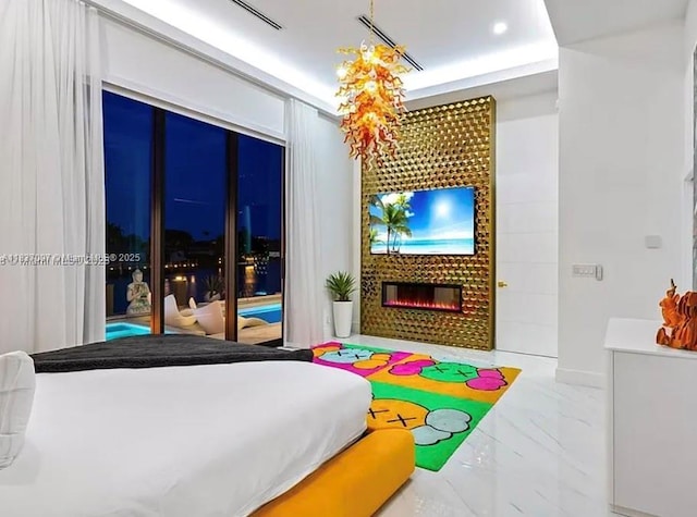 2225 NE 19th St, Fort Lauderdale, FL 33305 - bedroom featuring marble look tiles and a fireplace
