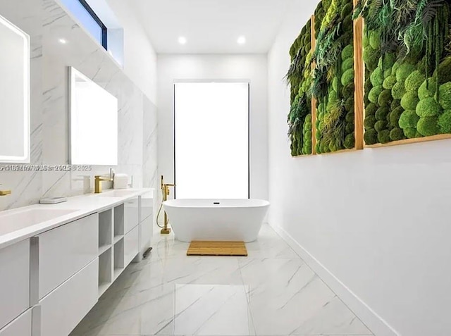 2225 NE 19th St, Fort Lauderdale, FL 33305 - bathroom with a freestanding bath, double vanity, recessed lighting, and marble finish floors