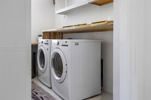 2225 NE 19th St, Fort Lauderdale, FL 33305 - washroom with washer and clothes dryer and light tile patterned floors