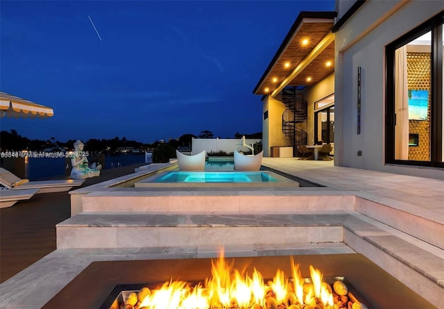 2225 NE 19th St, Fort Lauderdale, FL 33305 - pool at twilight with a patio area