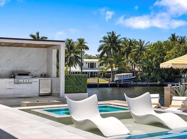 2225 NE 19th St, Fort Lauderdale, FL 33305 - view of pool with an outdoor kitchen, a water view, and a patio
