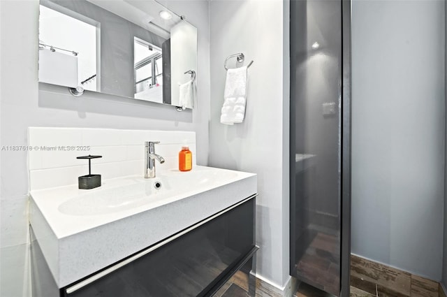 2778 Day Ave Unit 2, Miami, FL 33133 - bathroom with tasteful backsplash, vanity, and wood finished floors