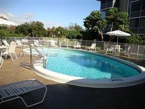 3776 Inverrary Blvd Unit 301R, Lauderhill, FL 33319 - community pool featuring a patio area
