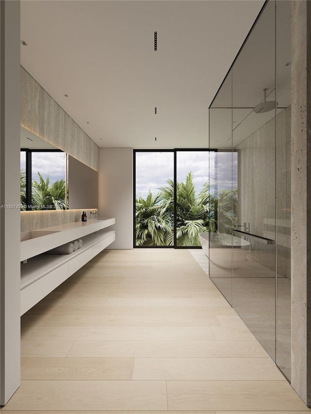 1661 Onaway Dr, Miami, FL 33133 - hallway with expansive windows and wood finished floors