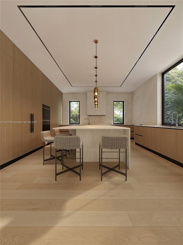 1661 Onaway Dr, Miami, FL 33133 - dining room with light wood-style flooring, healthy amount of natural light, and wooden walls