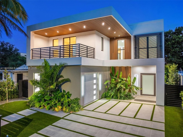 260 NW 47th St, Miami, FL 33127 - view of front of home with a balcony, stucco siding, and a garage