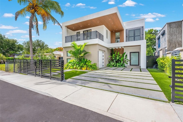 260 NW 47th St, Miami, FL 33127 - modern home with a balcony and stucco siding