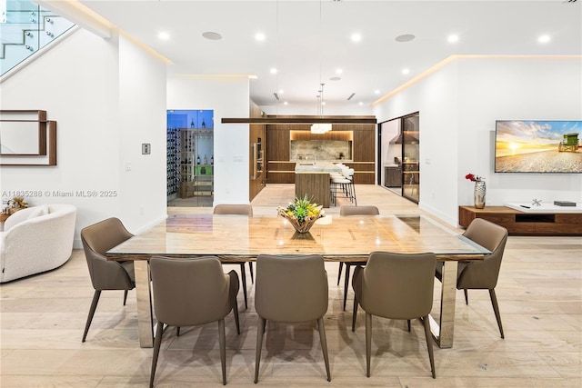 260 NW 47th St, Miami, FL 33127 - dining space featuring recessed lighting, light wood finished floors, stairs, and crown molding