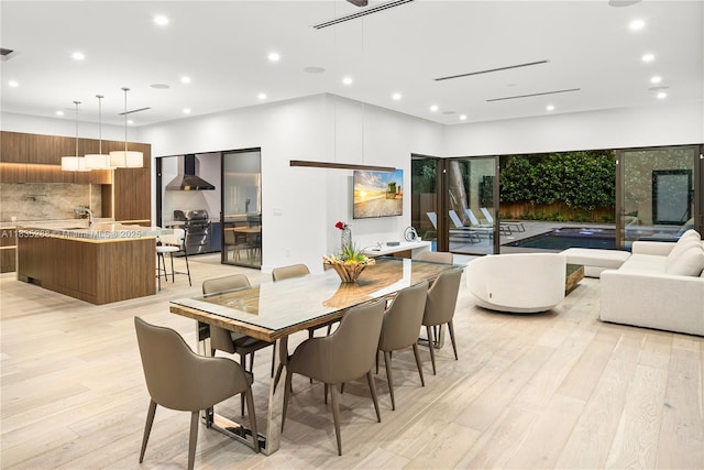 260 NW 47th St, Miami, FL 33127 - dining space featuring light wood finished floors and recessed lighting