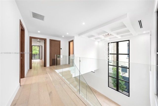 260 NW 47th St, Miami, FL 33127 - hall featuring beam ceiling, light wood-style floors, coffered ceiling, recessed lighting, and an upstairs landing