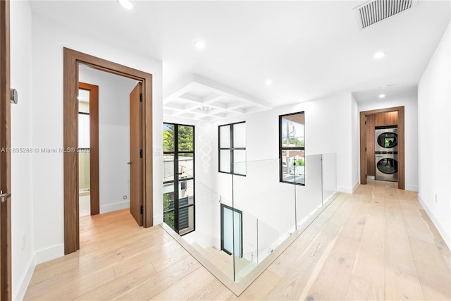 260 NW 47th St, Miami, FL 33127 - corridor featuring stacked washer / drying machine, coffered ceiling, light wood finished floors, recessed lighting, and beam ceiling