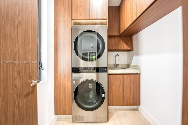 260 NW 47th St, Miami, FL 33127 - washroom featuring estacked washer and dryer and cabinet space