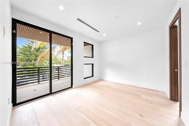 260 NW 47th St, Miami, FL 33127 - empty room with light wood-style flooring and recessed lighting